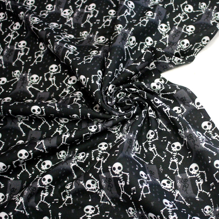 Tissu coton noir aux squelettes blancs - Collection Halloween - OEKO-TEX