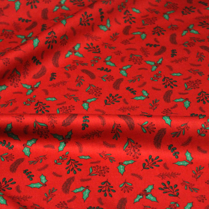 Tissu de coton de Noël rouge aux feuilles de houx vertes et branches de sapins verts - COLLECTION NOËL - OEKO-TEX
