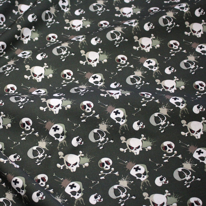 Tissu coton gris aux crânes et têtes de mort - Collection Halloween - OEKO-TEX