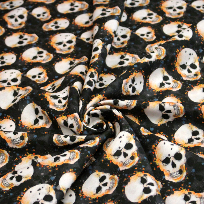 Tissu coton noir aux crânes et têtes de mort oranges - Collection Halloween - OEKO-TEX