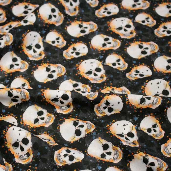 Tissu coton noir aux crânes et têtes de mort oranges - Collection Halloween - OEKO-TEX