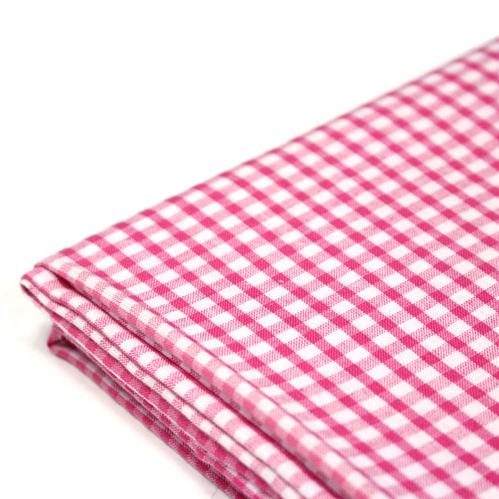 Tissu cotonnade blanc aux carreaux roses