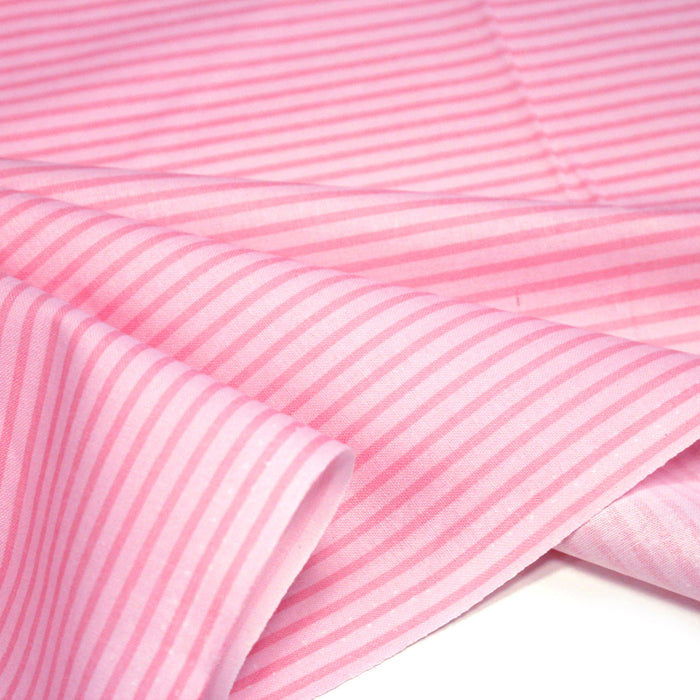 Tissu cotonnade aux rayures roses