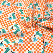 Tissu cotonnade enfant aux carreaux oranges, croissants et cafetière Moka - STANDARD 100 OEKO-TEX - TissusPapi.com