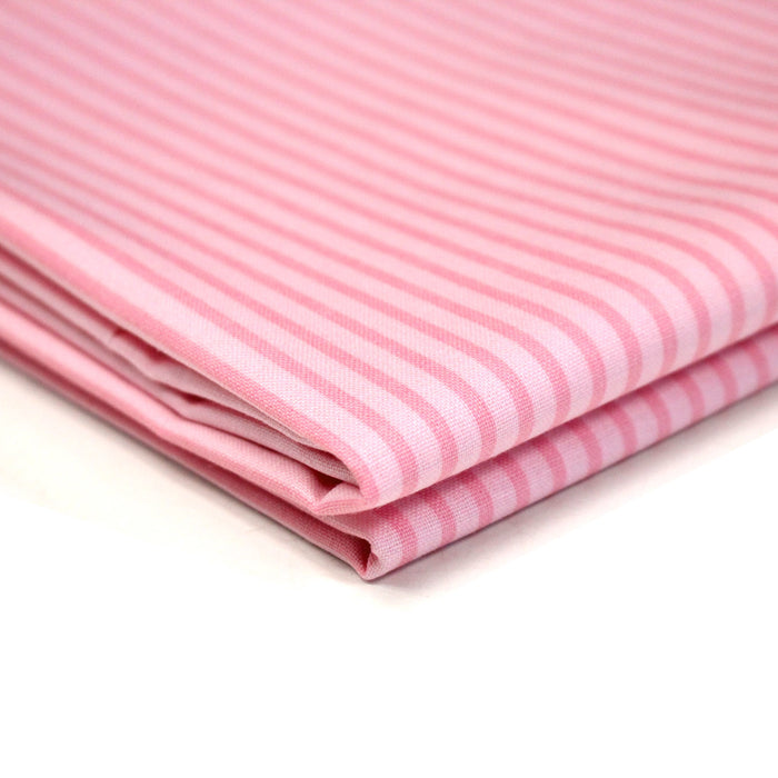 Tissu cotonnade aux rayures roses