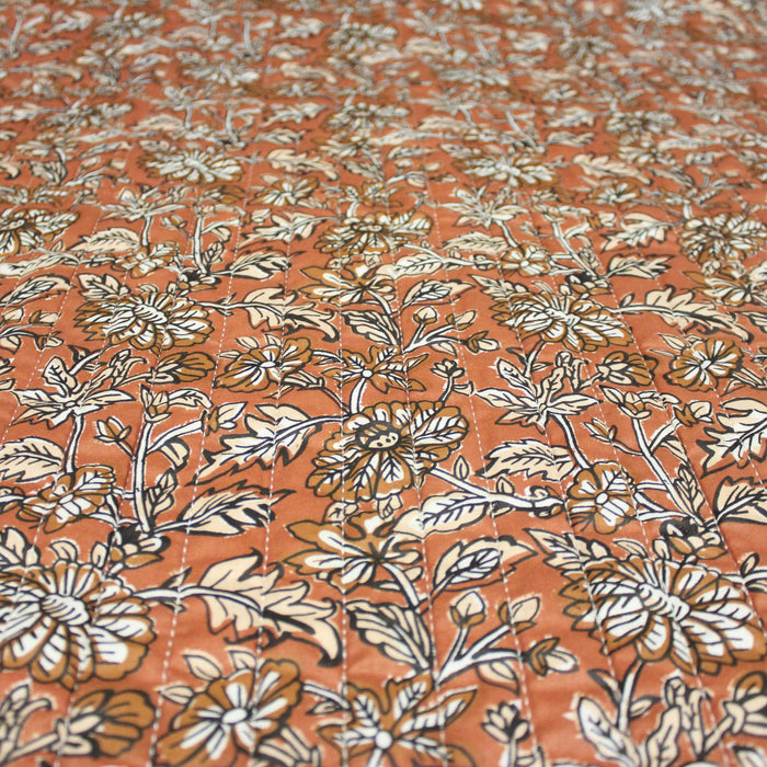 Tissu Coton imprimé fleur de lys beige sur fond marron