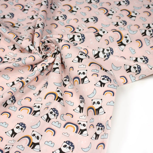 Tissu popeline coton ENFANT rose aux pandas endormis, arcs en ciel et nuages - TissusPapi.com