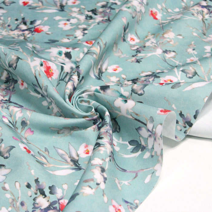 Tissu gabardine de coton LUXE imprimée motif fleurs d'aubépine façon aquarelle, fond bleu