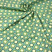 Tissu popeline coton vert aux formes géométriques vertes et jaunes - TissusPapi.com