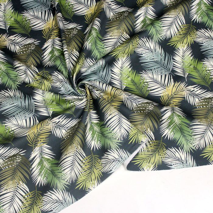 Tissu gabardine de coton LUXE imprimée motif feuillage tropical blanc & vert, fond bleu pétrole