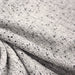 Tissu Tweed coton laine faux-uni blanc gris, taches noires - Fabrication française - TissusPapi.com