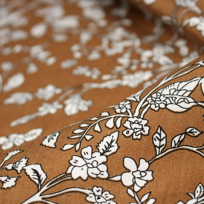 Tissu viscose fluide, fines fleurs blanches et noirs, fond ocre ou fond vert