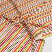 Tissu Bayadère de coton aux rayures oranges, rouges et roses, fond blanc - TissusPapi.com