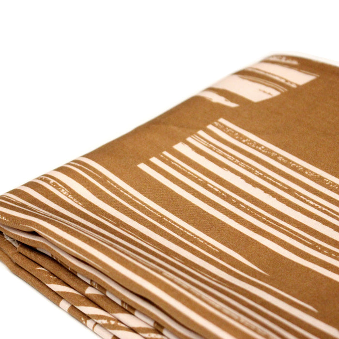 Tissu viscose fluide, motifs et traits géométriques écrus, fond ocre