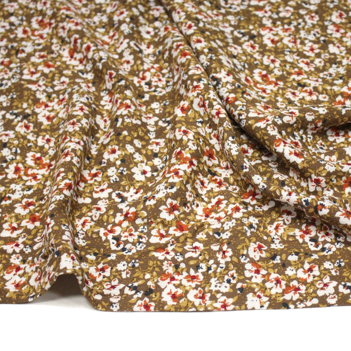 Tissu Viscose crêpe ocre fleuri blanc rouille noir - TissusPapi.com
