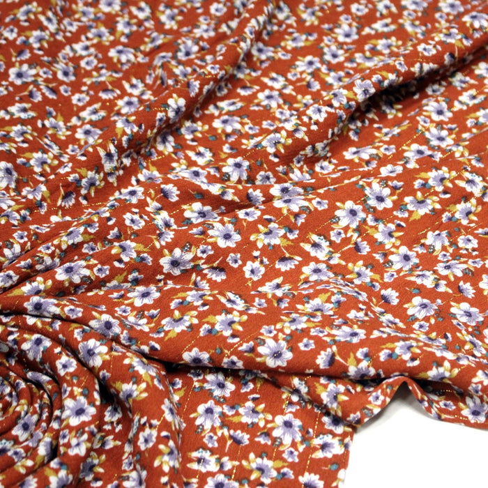 Tissu Viscose crêpe rouille, fleuri blanc & mauve et liserés lurex dorés - TissusPapi.com
