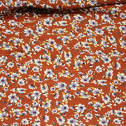 Tissu Viscose crêpe rouille, fleuri blanc & mauve et liserés lurex dorés - TissusPapi.com