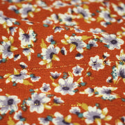 Tissu Viscose crêpe rouille, fleuri blanc & mauve et liserés lurex dorés - TissusPapi.com