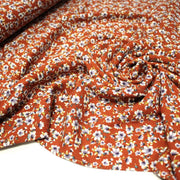 Tissu Viscose crêpe rouille, fleuri blanc & mauve et liserés lurex dorés - TissusPapi.com