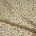 Tissu popeline coton ocre clair aux fleurs & fines arabesques noirs et jaunes - TissusPapi.com