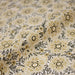 Tissu popeline coton ocre clair aux fleurs & fines arabesques noirs et jaunes - TissusPapi.com
