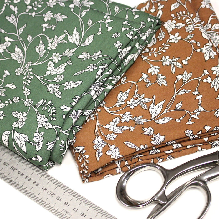 Tissu viscose fluide, fines fleurs blanches et noirs, fond ocre ou fond vert