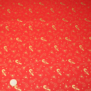 Tissu coton NOËL rouge aux houx et sucres d'orge dorés - OEKO - TEX - TissusPapi.com