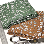 Tissu viscose fluide, fines fleurs blanches et noirs, fond ocre ou fond vert - TissusPapi.com
