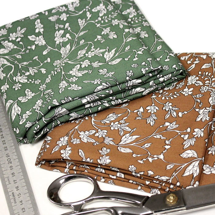 Tissu viscose fluide, fines fleurs blanches et noirs, fond ocre ou fond vert