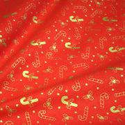 Tissu coton NOËL rouge aux houx et sucres d'orge dorés - OEKO - TEX - TissusPapi.com