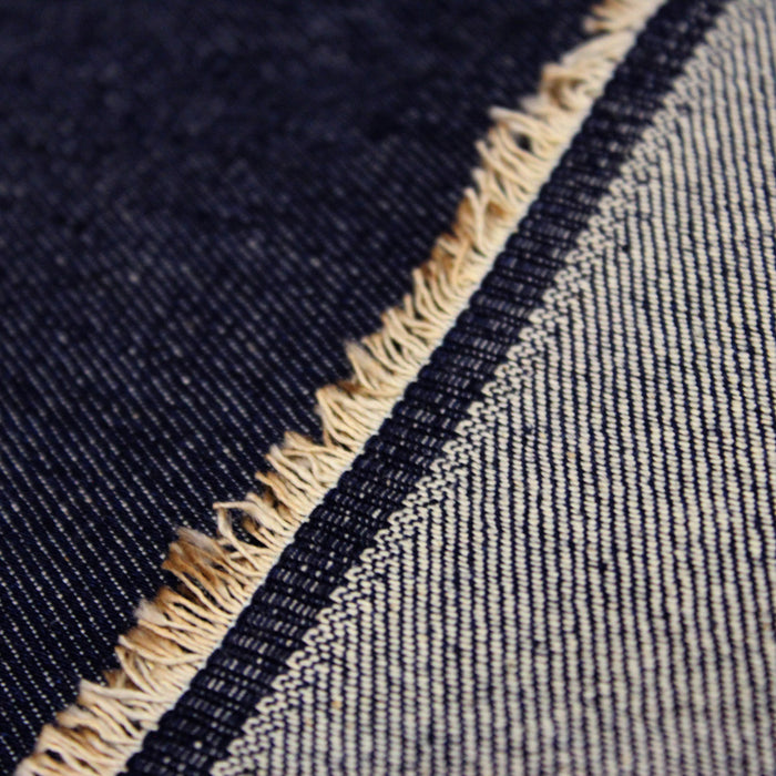 Tissu toile de jean denim brut bleu uni 100% coton