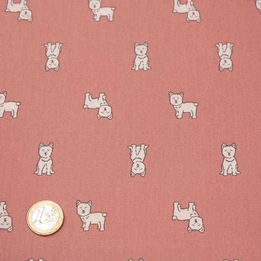 Tissu de coton vieux rose aux petits chiens écrus