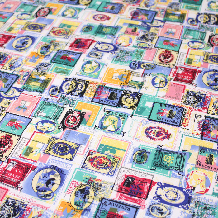 Tissu popeline de coton aux timbres multicolores, fond blanc