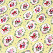 Tissu popeline jaune aux macarons fleuris britanniques - TissusPapi.com