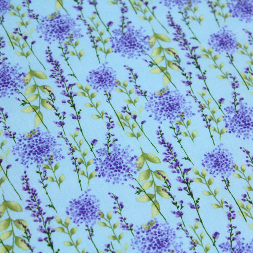 Tissu popeline de coton LAVANDE aux fleurs parme et feuilles vertes, fond bleu ciel - tissuspapi