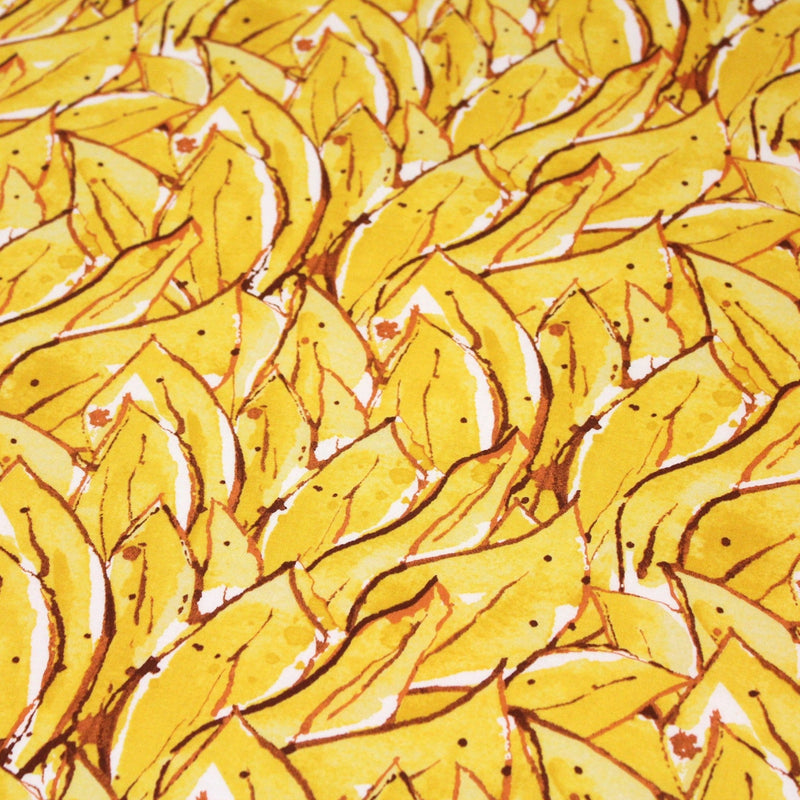 Tissu popeline de coton SUMATRA au feuillage tropical jaune, fond blanc - TissusPapi.com