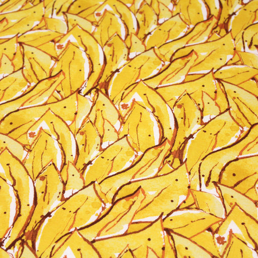 Tissu popeline de coton SUMATRA au feuillage tropical jaune, fond blanc - tissuspapi