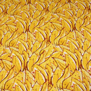Tissu popeline de coton SUMATRA au feuillage tropical jaune, fond blanc - TissusPapi.com