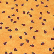 Tissu popeline de coton aux petites coccinelles rouges, fond jaune safran - TissusPapi.com