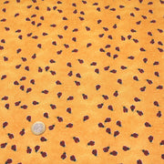 Tissu popeline de coton aux petites coccinelles rouges, fond jaune safran - TissusPapi.com