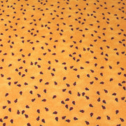 Tissu popeline de coton aux petites coccinelles rouges, fond jaune safran - TissusPapi.com