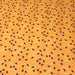 Tissu popeline de coton aux petites coccinelles rouges, fond jaune safran