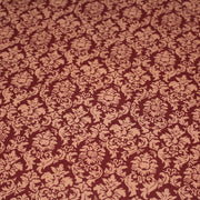 Tissu popeline de coton aux arabesques caramel, fond rouge bordeaux - COLLECTION LOUIS - TissusPapi.com