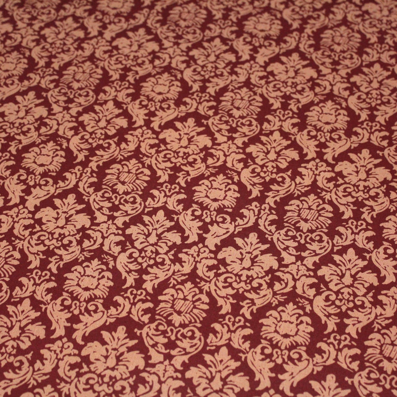 Tissu popeline de coton aux arabesques caramel, fond rouge bordeaux - COLLECTION LOUIS - TissusPapi.com