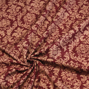 Tissu popeline de coton aux arabesques caramel, fond rouge bordeaux - COLLECTION LOUIS - TissusPapi.com