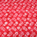 Tissu de coton Batik fond rouge clair aux fleurs blanches