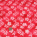 Tissu de coton Batik fond rouge clair aux fleurs blanches - tissuspapi