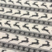Tissu de coton de Noël scandinave aux rennes & étoiles de neiges gris, fond écru - TissusPapi.com