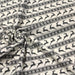 Tissu de coton de Noël scandinave aux rennes & étoiles de neiges gris, fond écru - TissusPapi.com