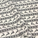 Tissu de coton de Noël scandinave aux rennes & étoiles de neiges gris, fond écru - TissusPapi.com